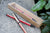 Stylo bille 7PLIS skateboard recyclé rouge framboise et bois - 7PLIS